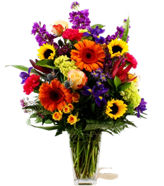 Sunny with a Chance of Blooms includes gerber daisies, sunflowers, roses, wax and iris in glass vase