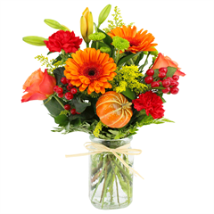  includes orange lilies, orange roses, red carnations, berries, and assorted greens.