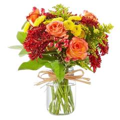 flower arrangement includes lilies, roses, sunflowers, spray roses, snapdragons in a clear mason jar